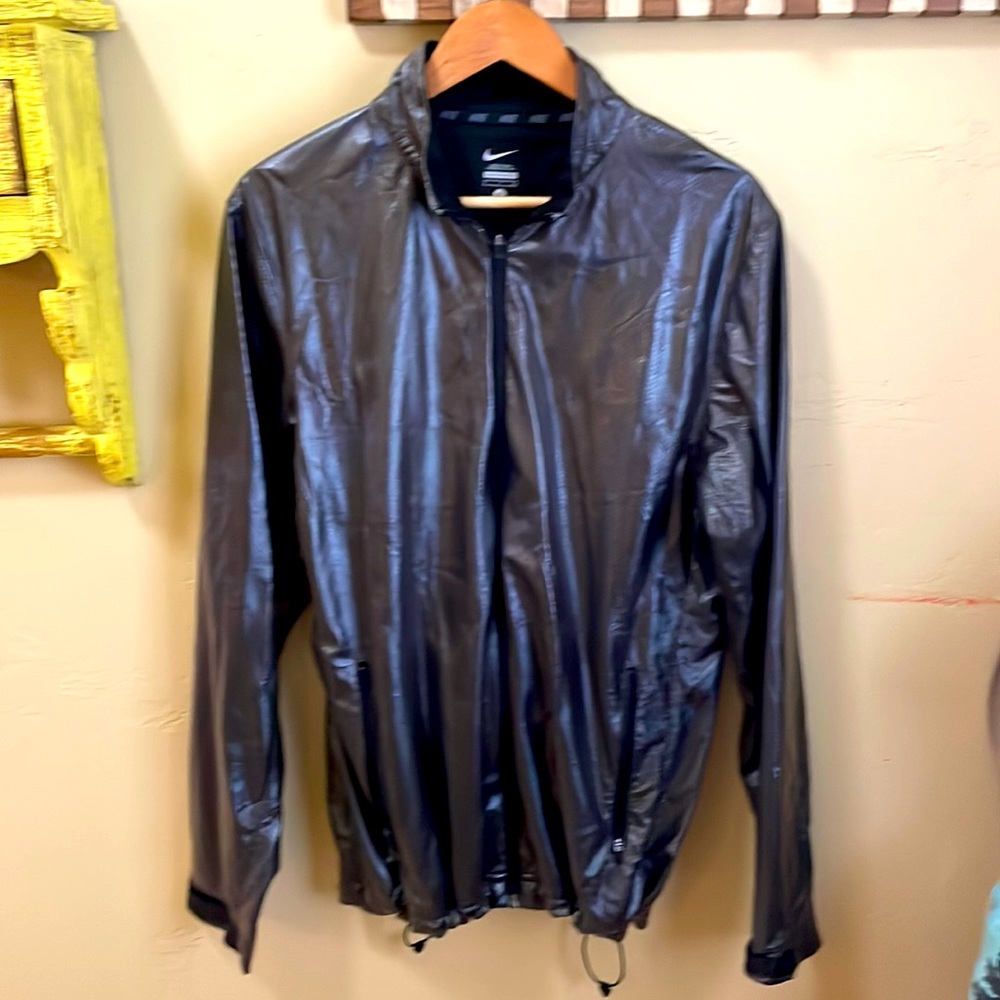 Nike size small, dark gray metallic windbreaker with pockets